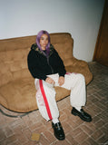 DAXUEN Loose-fitting wide-leg track pants with red graphics — model photo