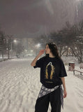DAXUEN Distressed graphic T-shirt with human silhouette — model photo