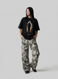 DAXUEN Distressed graphic T-shirt with human silhouette — model photo