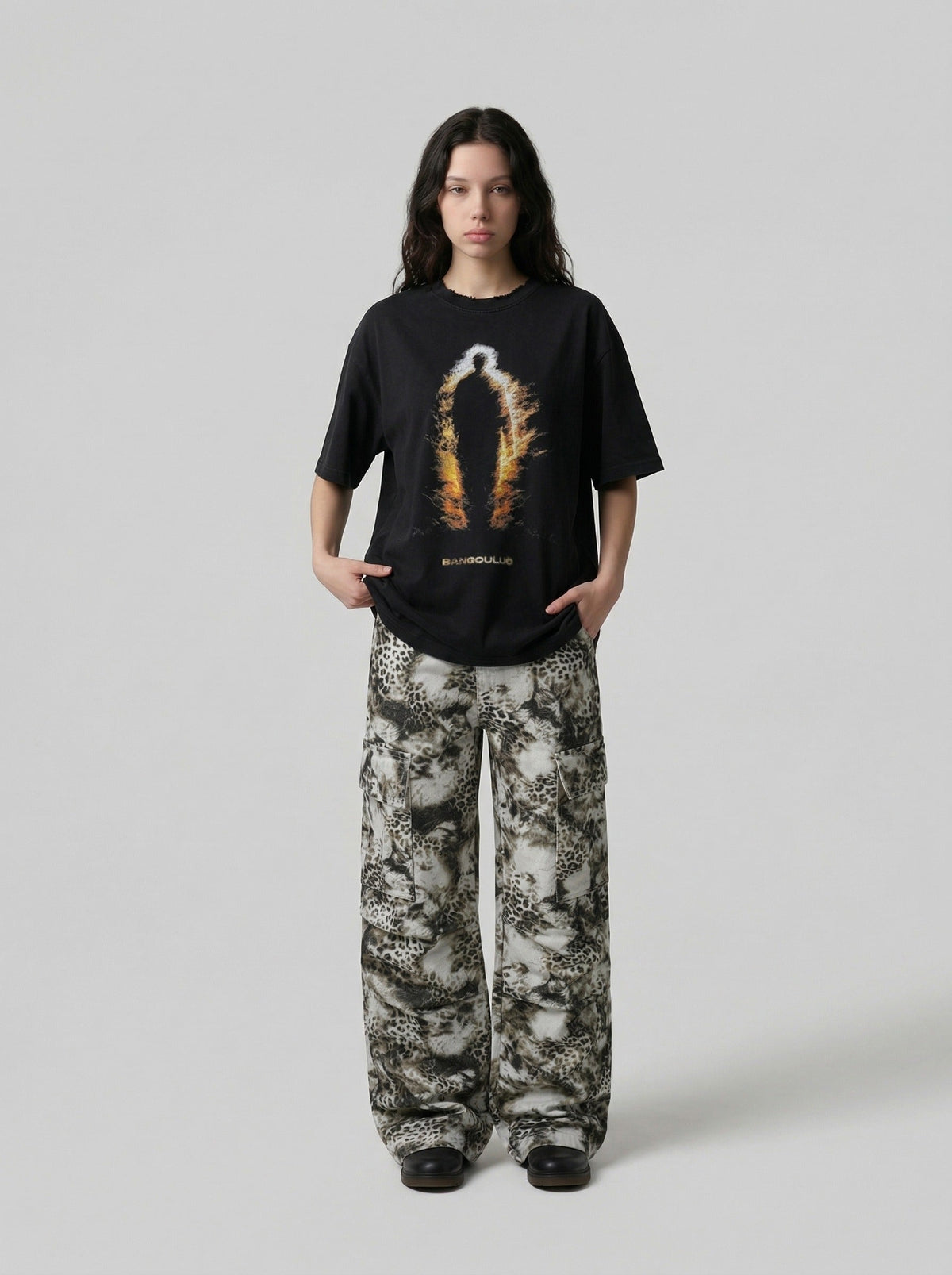 DAXUEN Distressed graphic T-shirt with human silhouette — model photo