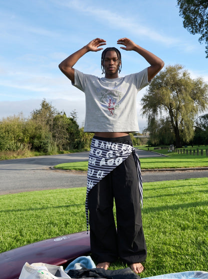 DAXUEN BANGOULUOU Graphic T-Shirt with floral and cartoon prints — model photo