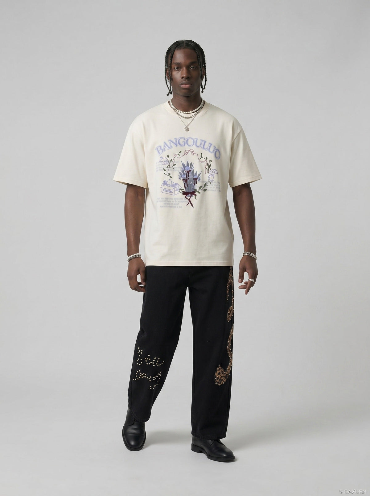 DAXUEN BANGOULUOU Graphic T-Shirt with floral and cartoon prints — model photo
