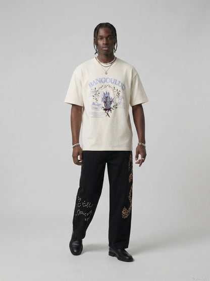DAXUEN BANGOULUOU Graphic T-Shirt with floral and cartoon prints — model photo