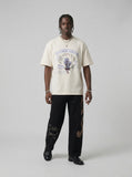 DAXUEN BANGOULUOU Graphic T-Shirt with floral and cartoon prints — model photo