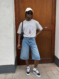 DAXUEN BANGOULUOU Graphic T-Shirt with floral and cartoon prints — model photo