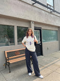 DAXUEN BANGOULUOU Graphic T-Shirt with floral and cartoon prints — model photo