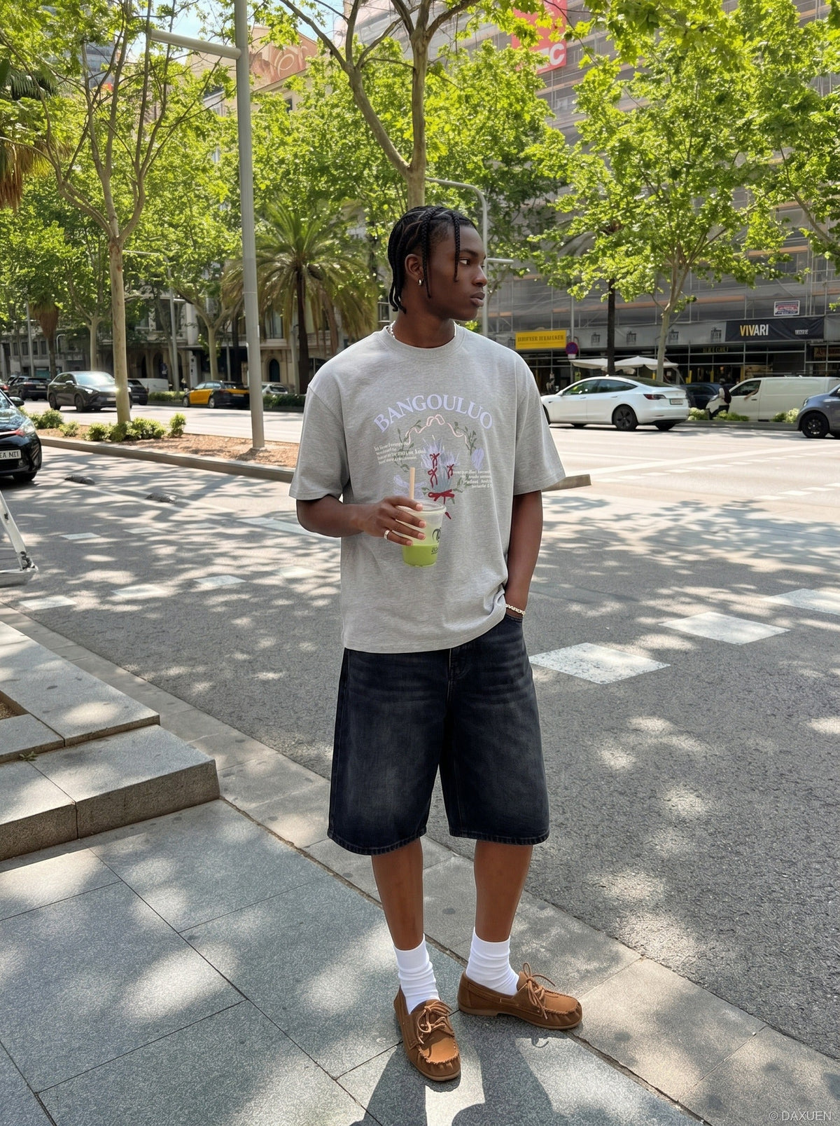 DAXUEN BANGOULUOU Graphic T-Shirt with floral and cartoon prints — model photo