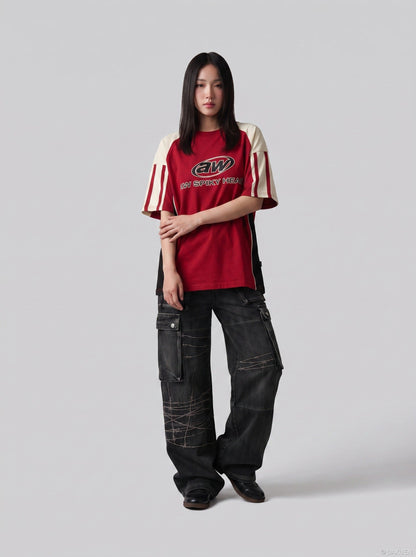 DAXUEN faded blue cargo jeans with barbed wire embroidery — model photo