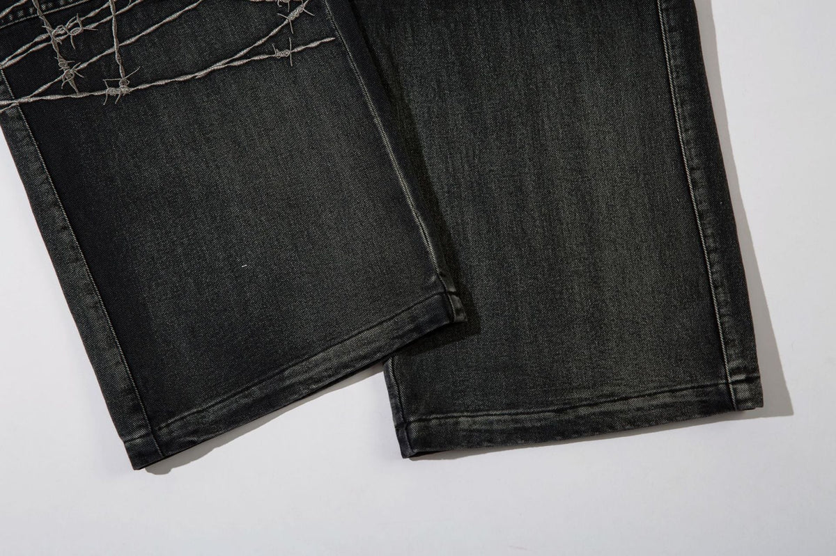 DAXUEN faded blue cargo jeans with barbed wire embroidery