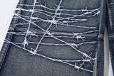 DAXUEN faded blue cargo jeans with barbed wire embroidery