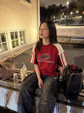 DAXUEN faded blue cargo jeans with barbed wire embroidery — model photo