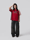 DAXUEN faded blue cargo jeans with barbed wire embroidery — model photo