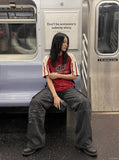 DAXUEN faded blue cargo jeans with barbed wire embroidery — model photo