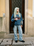 DAXUEN washed blue denim baseball-embroidered pullover shirt — model photo