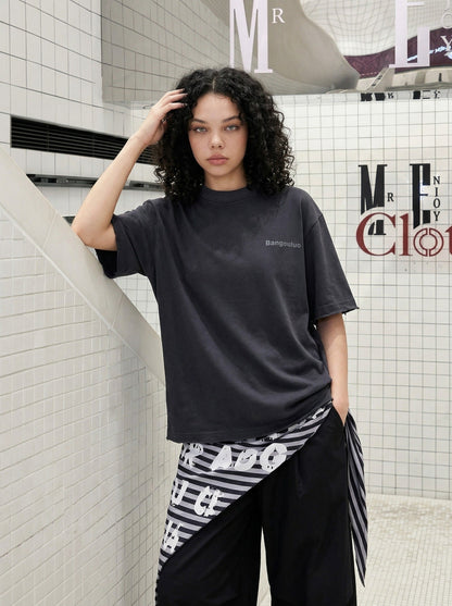 DAXUEN Distressed short-sleeve T-shirt with graphic panel — model photo