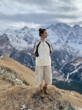 DAXUEN beige wide-leg cargo shorts with pockets — model photo