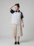 DAXUEN beige wide-leg cargo shorts with pockets — model photo