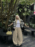 DAXUEN Beige high-waisted wide leg trousers — model photo