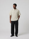 DAXUEN Beige oversized short-sleeve button-up shirt — model photo