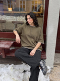 DAXUEN black and olive contrast stitch Henley top — model photo