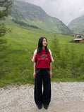 DAXUEN black oversized balloon pants with silver studs — model photo