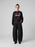 DAXUEN black barrel-cut wide-leg trousers — model photo