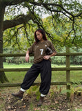 DAXUEN black barrel-cut wide-leg trousers — model photo
