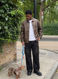 DAXUEN black wide-leg cargo pants with embroidered flag and studs — model photo