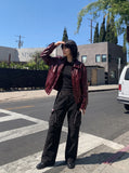 DAXUEN black wide-leg cargo pants with embroidered flag and studs — model photo