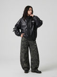 DAXUEN black crocodile-embossed faux leather jacket — model photo