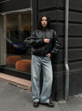 DAXUEN black crocodile-embossed faux leather jacket — model photo