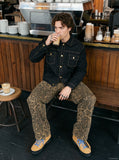 DAXUEN black denim jacket with gold detailing — model photo