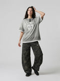 DAXUEN Grey marl short-sleeved t-shirt with graphic print — model photo