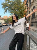 DAXUEN White ringer T-shirt with bold text and graphic — model photo