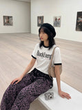 DAXUEN White ringer T-shirt with bold text and graphic — model photo