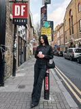 DAXUEN black faux leather jacket with embossed buttons — model photo