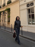 DAXUEN black faux leather motorcycle jacket with snap details — model photo