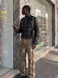 DAXUEN black faux leather motorcycle jacket with snap details — model photo