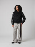 DAXUEN black oversized bomber jacket with faux leather sleeves — model photo