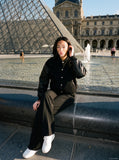DAXUEN black oversized bomber jacket with faux leather sleeves — model photo