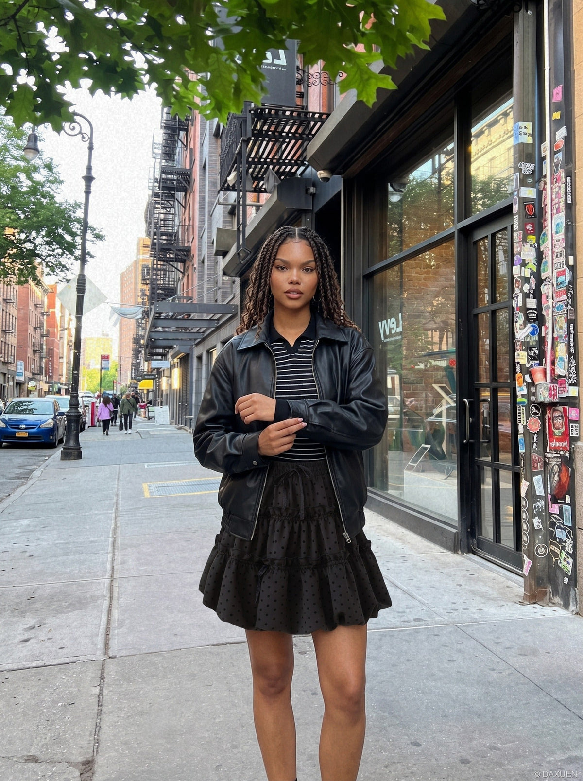 DAXUEN black tiered polka dot mini skirt — model photo