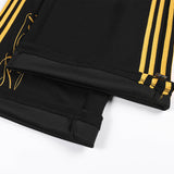 DAXUEN black wide-leg sweatpants with yellow stripes