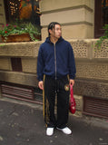 DAXUEN black wide-leg sweatpants with yellow stripes — model photo