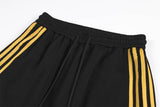 DAXUEN black wide-leg sweatpants with yellow stripes