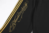 DAXUEN black wide-leg sweatpants with yellow stripes
