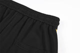DAXUEN black wide-leg sweatpants with yellow stripes
