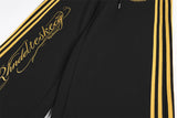 DAXUEN black wide-leg track pants with embroidered crest
