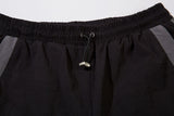 DAXUEN black wide-leg track pants with dark grey curved panels