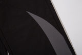 DAXUEN black wide-leg track pants with dark grey curved panels