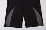 DAXUEN black wide-leg track pants with dark grey curved panels